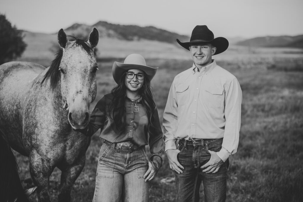 A brother, and sister Posing for a photo with their gray horse on their family ranch during a Ranch family legacy photo shoot