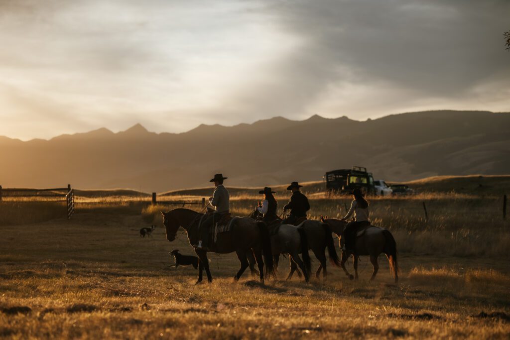 a family riding horses on their ranch during a Ranch family legacy photo shoot