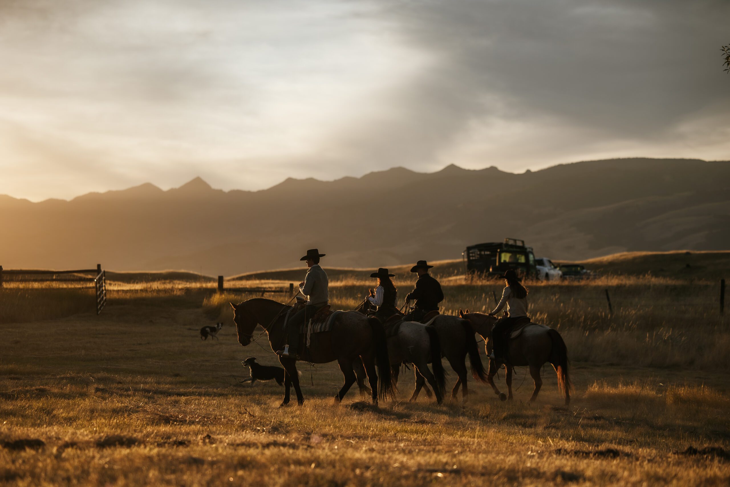 a family riding horses on their ranch